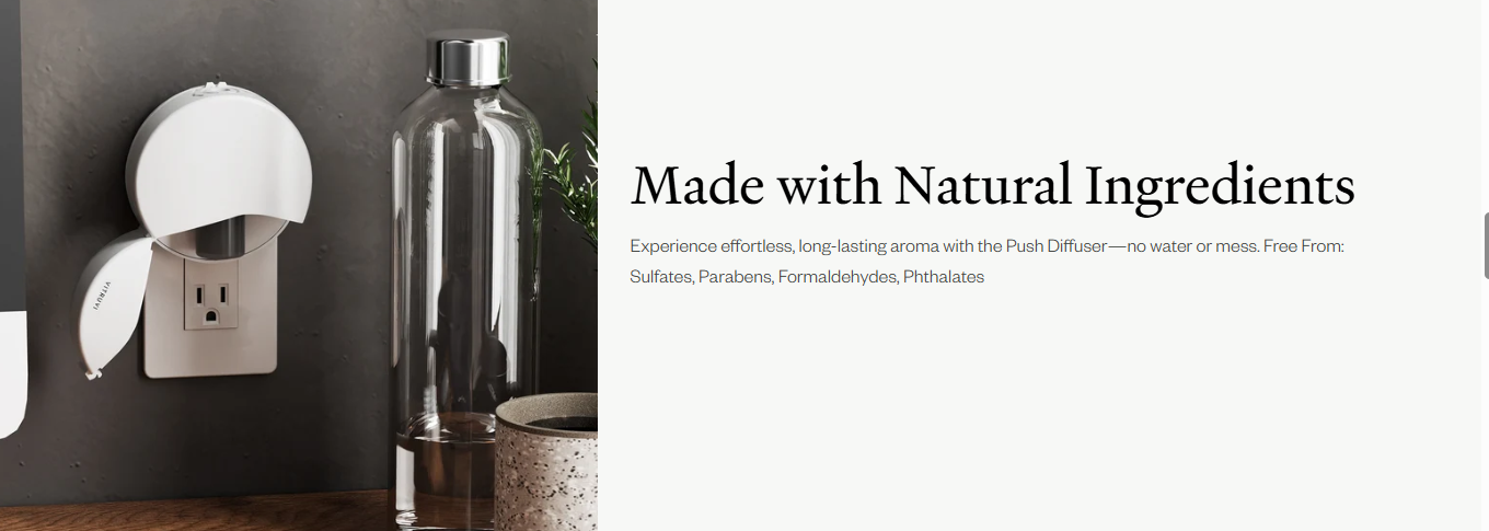 White wall plug diffuser beside a fragrance refill bottle